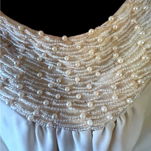 mm Tops - Sleeveless top with beaded and embellished collar. Very light fabric.